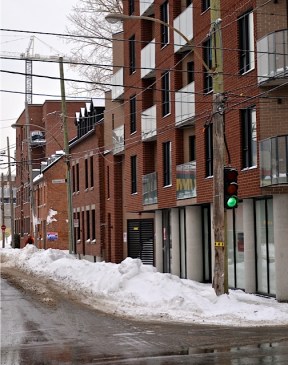 New condo tower and the Griffintown Horse Palace, January 2014. Photo courtesy of Dave Flavell